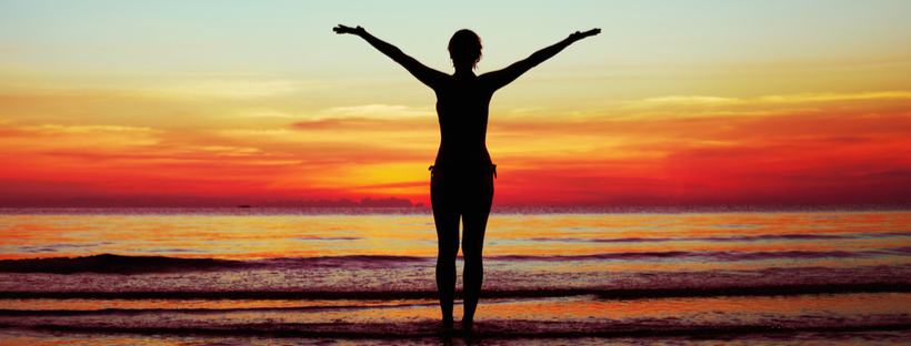 silhouette of a woman on a beach