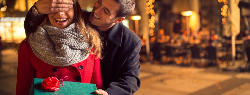 Girl receiving a gift from her boyfriend