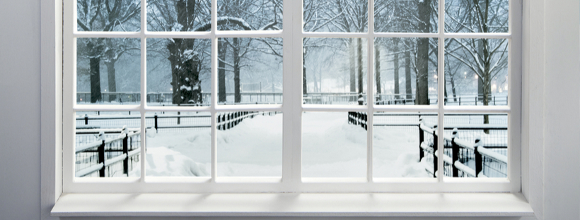 Window overlooking a snow covered front yard
