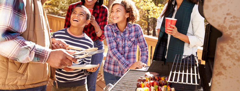 Children enjoying an outdoor barbecue