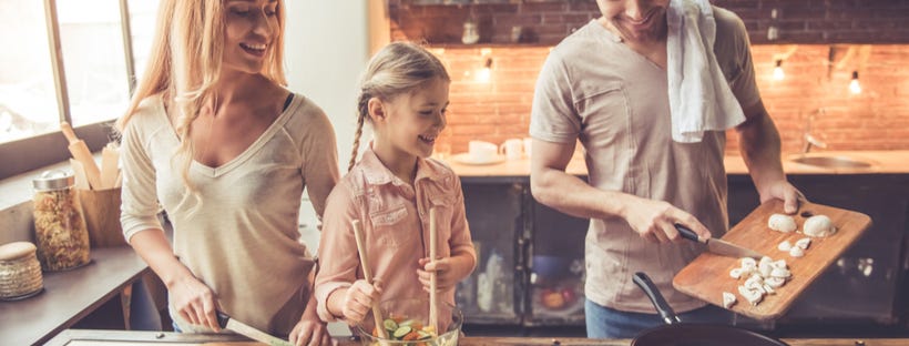 Young family cooking together